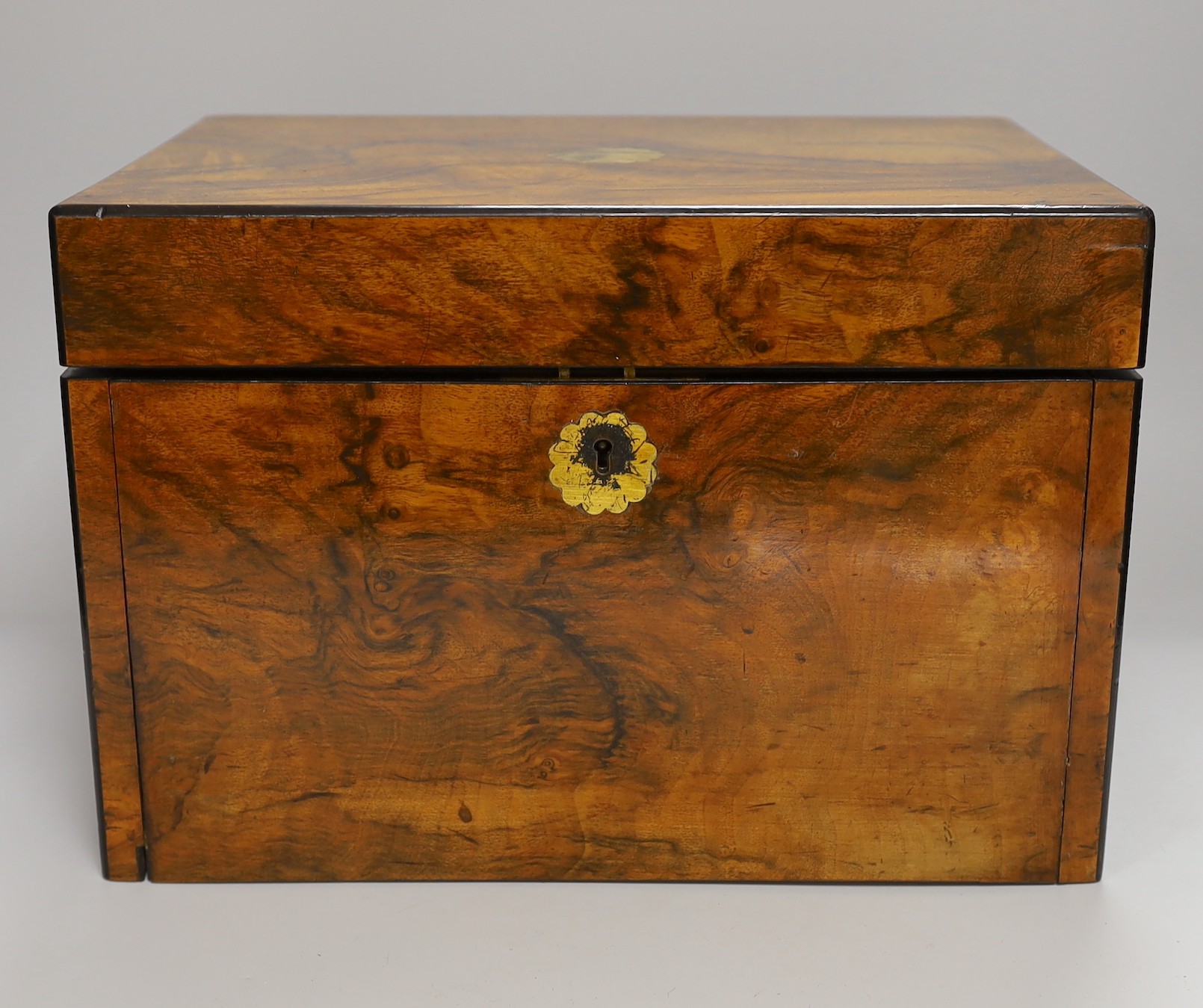 A Victorian walnut sewing casket with concealed spring loaded writing slope, 33.5cms wide x 23cms high